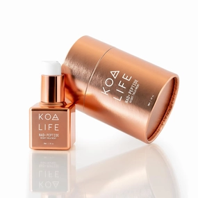 KOA Life NAD Peptide Facial Daily Anti-Aging Serum. in a Metallic Copper Glass Dropper Bottle and Metallic Copper Outer Cylinder Carton